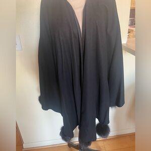 Woman shall wrap black with fur pompon made  in France. Elevate style & look